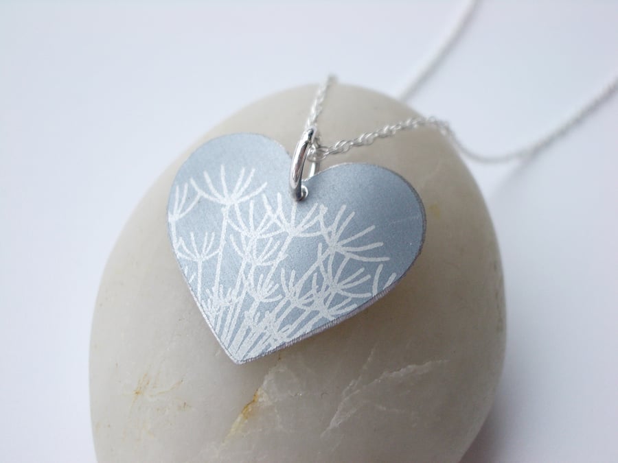 Silver heart pendant necklace with dandelion seeds