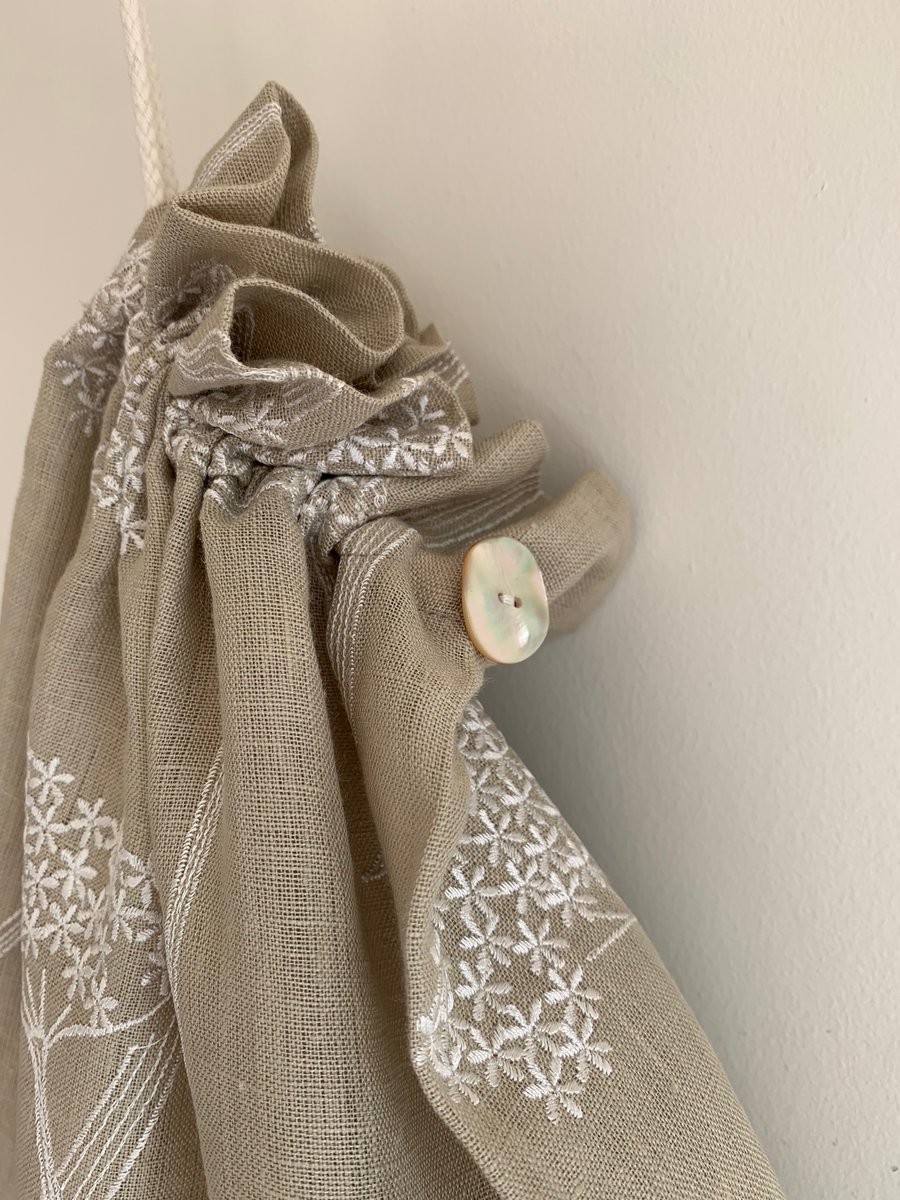 Embroidered linen drawstring bag