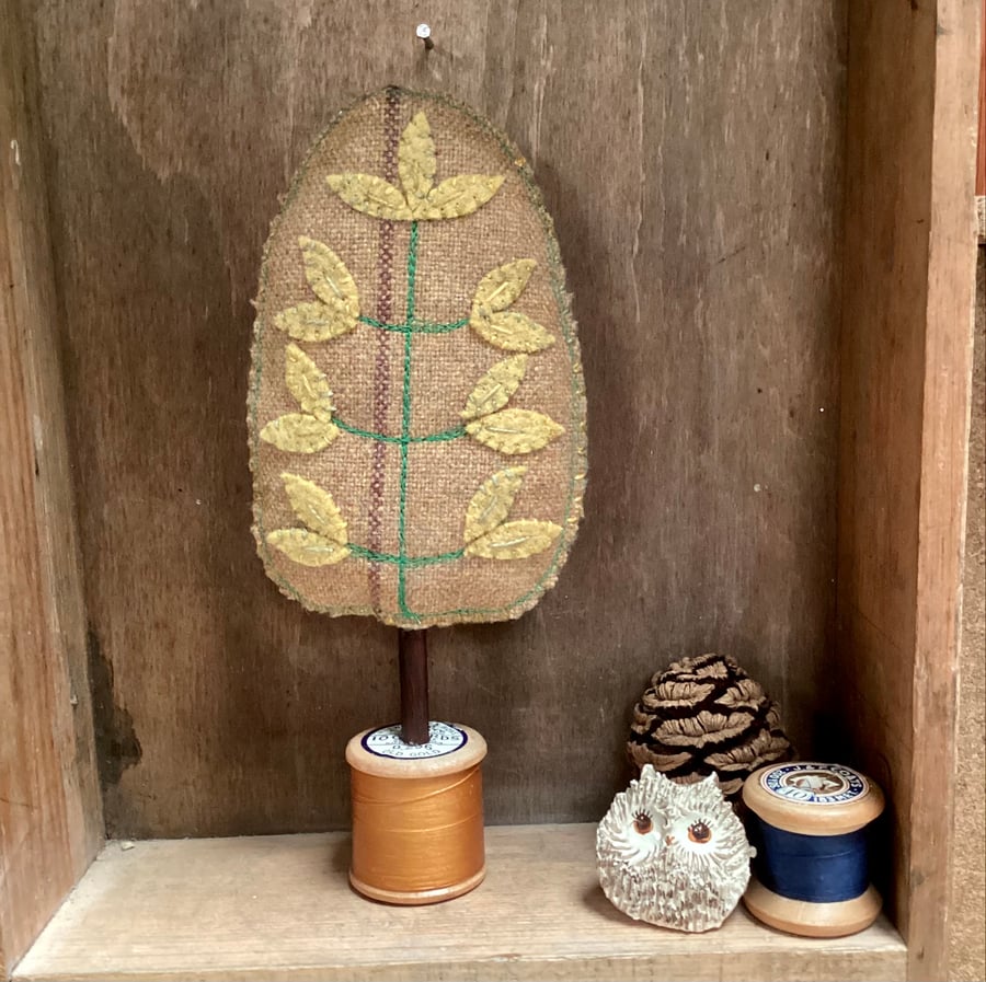 Fine suiting fabric tree with golden leaves
