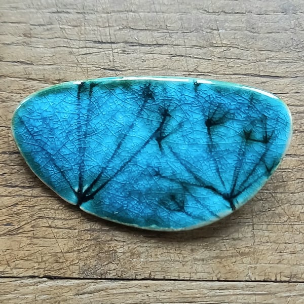 Seed head brooch