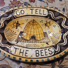 Oval slip ware dish with hand painted bee skep