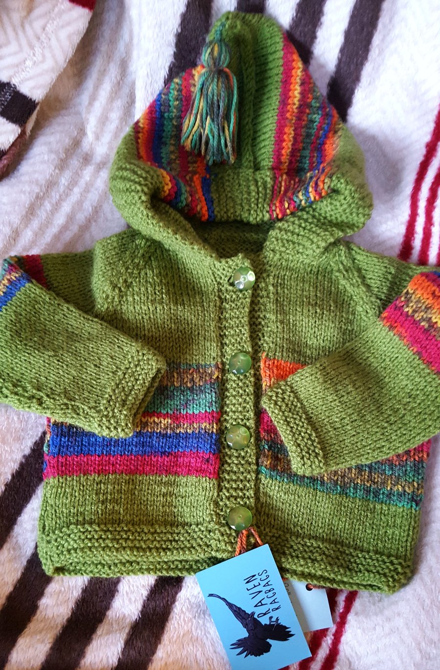 Colourful hand-knitted baby hoodie