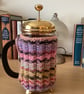 HAND KNITTED CAFETIERE COSY FOR A 1 LITRE COFFEE POT IN MULTICOLOURED YARN