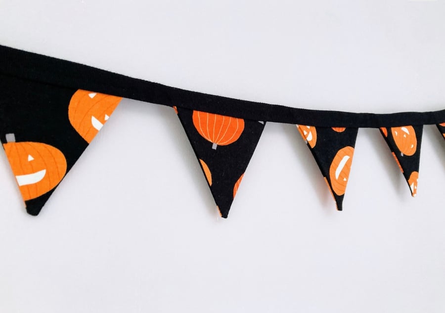 Orange pumpkins on black cotton double sided fabric mini bunting.