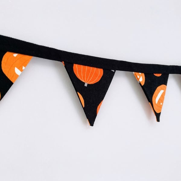 Orange pumpkins on black cotton double sided fabric mini bunting.