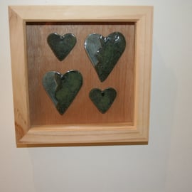 Wooden frame with handmade green & speckled blue ceramic hearts 