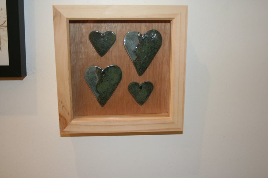 Wooden frame with handmade green & speckled blue ceramic hearts 