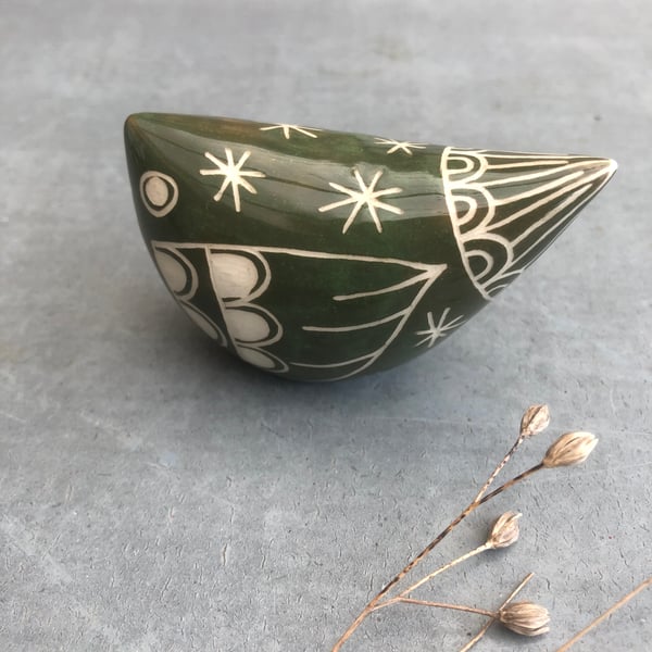 Small green  ceramic bird .