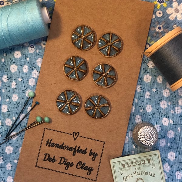 Set of 6 small handcrafted ceramic ‘spoke’ buttons in rutile blue