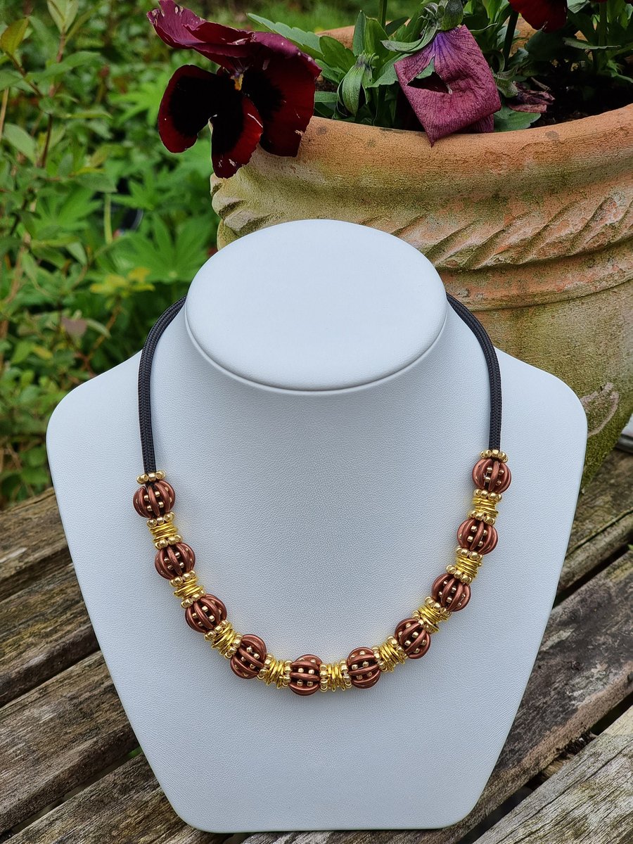 Beaded Necklace 16 inches with 10 beaded beads in Brown and Gold. Adjustable 