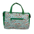 large toiletries bag made from  Liberty fabric, with handles and pockets in and 