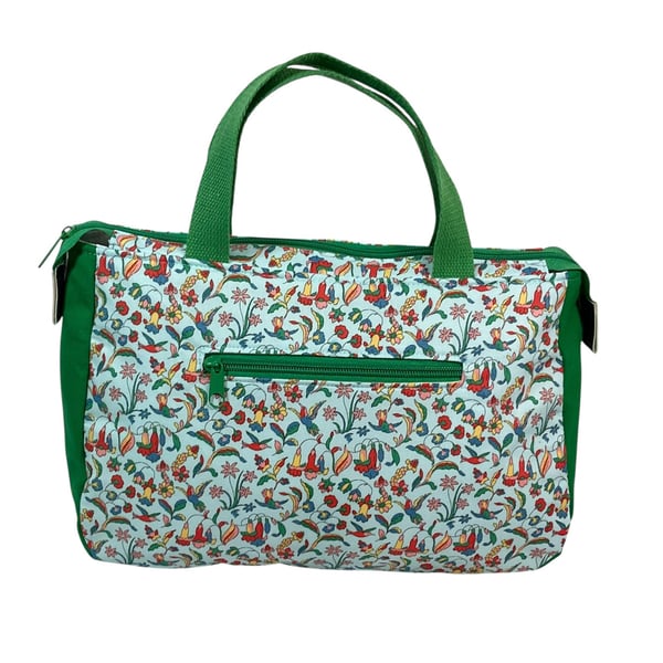 large toiletries bag made from  Liberty fabric, with handles and pockets in and 