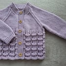 Baby girls cardigan to fit approx 6-12 months hand-knitted in lilac baby yarn 