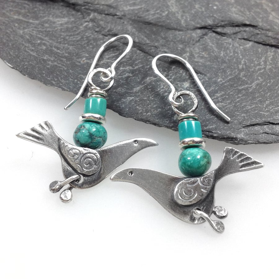 silver bird earrings with turquoise.