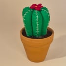Felt cactus with flower in a terracotta pot