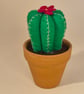 Felt cactus with flower in a terracotta pot