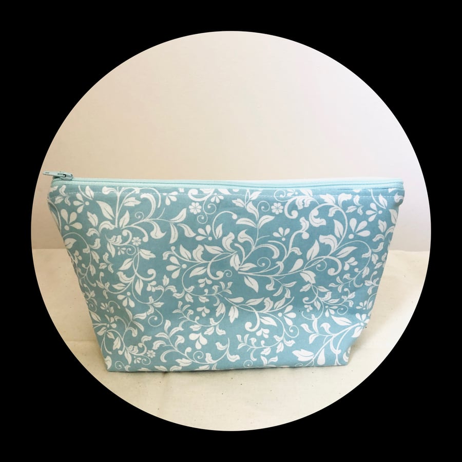 Toiletry bag.Pastel green with white leaf floral design.Fully lined.