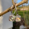 Silver square earrings set with abalone, heart cutout on back on handmade hoops