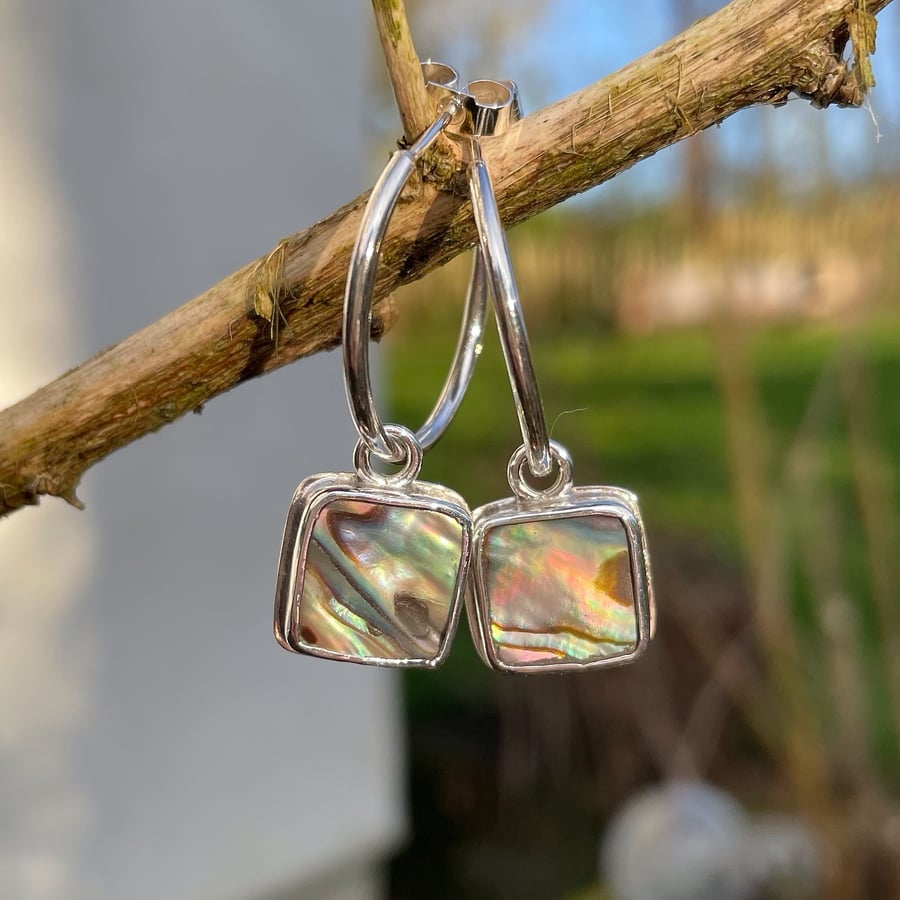 Silver square earrings set with abalone, heart cutout on back on handmade hoops