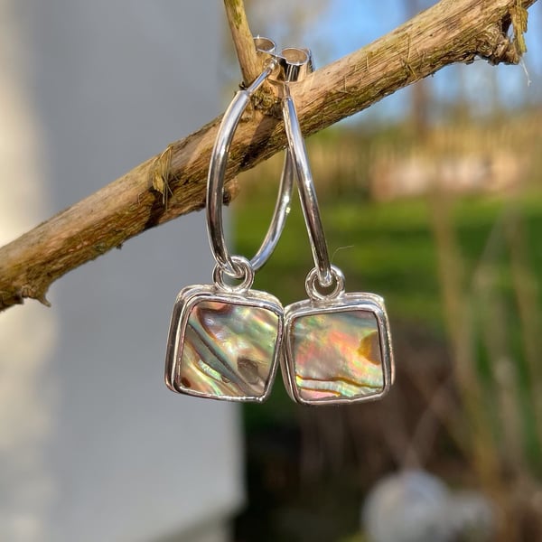 Silver square earrings set with abalone, heart cutout on back on handmade hoops
