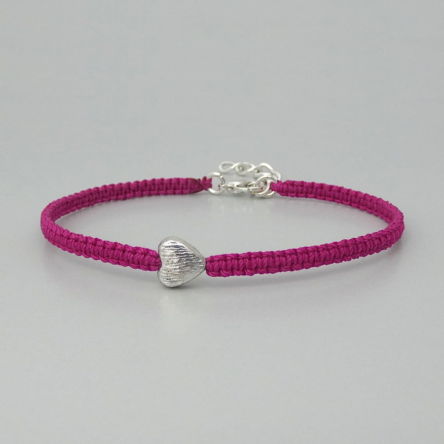 Magenta 7" macramé bracelet with silver plated heart charm and 1” extender chain