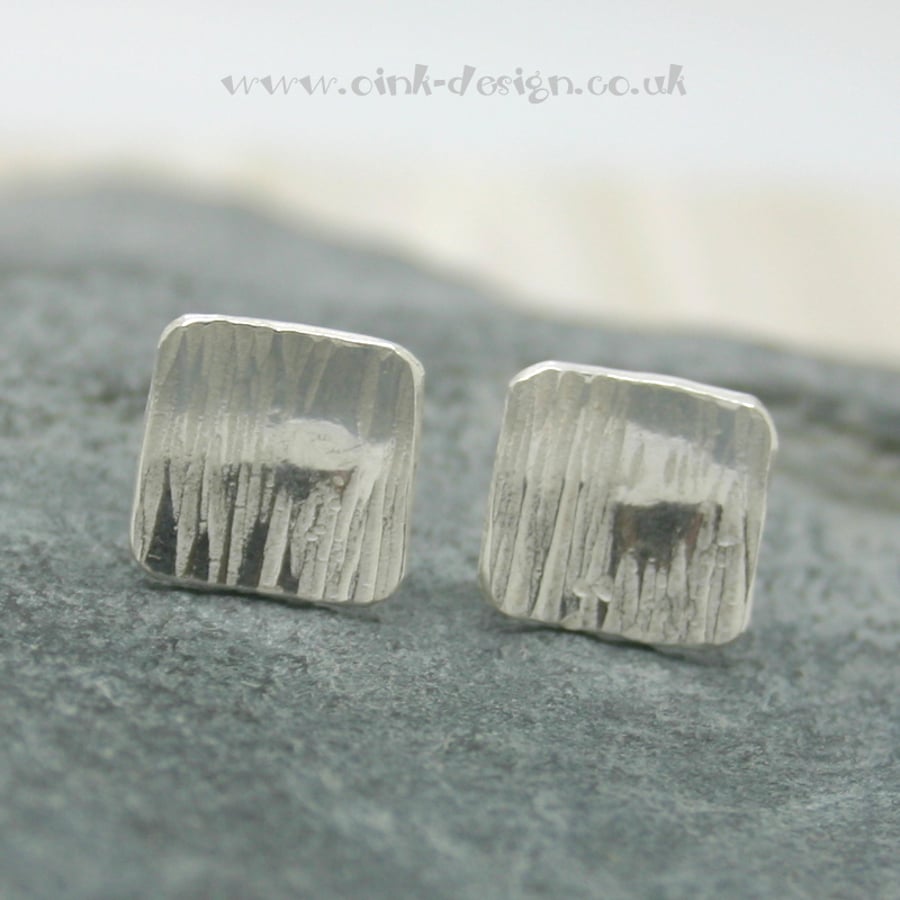  Sterling silver square stud earrings with a hammered finish and slightly domed