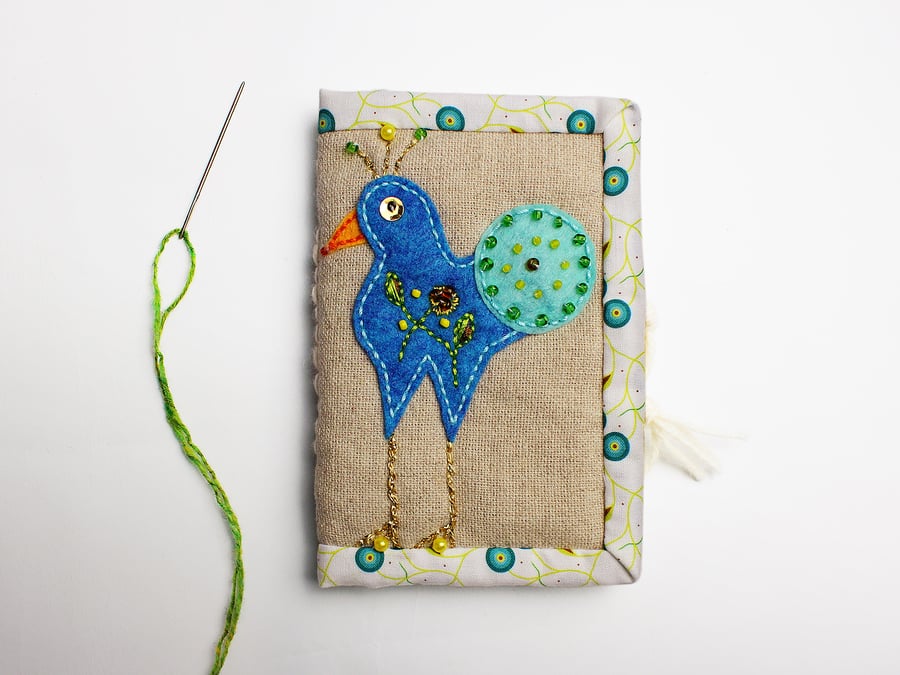 Oatmeal linen needle case with hand appliquéd peacock