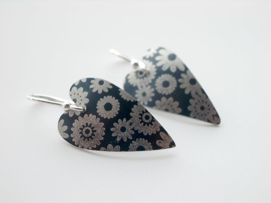 Black charcoal heart earrings with printed flowers