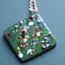 Square green enamel pendant decorated with frit