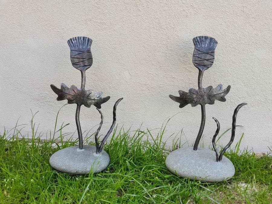 Hand crafted thistle sculpture mounted in stone base