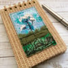 Embroidered wild flower raffia reporters notepad. 