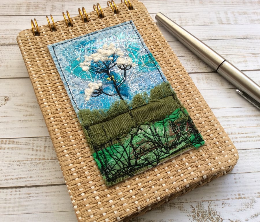 Embroidered wild flower raffia reporters notepad. 