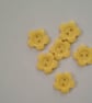 6 pale yellow flower buttons.