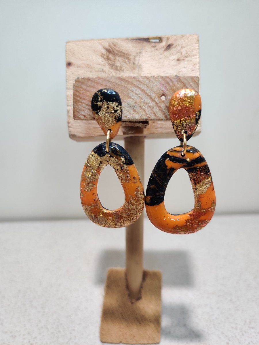 Orange galaxy hollow pebble earrings