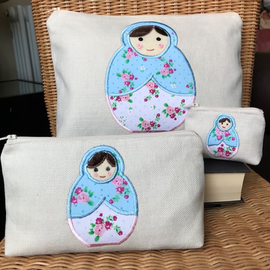 Russian doll stacking toiletry bag, cosmetic bag and purse with floral dolls
