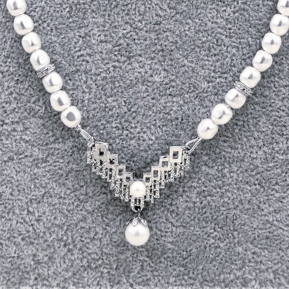 Gorgeous pearl necklace with a unique front fastening silver and pearl clasp