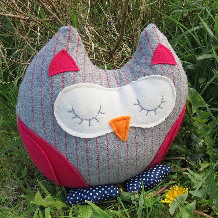 A snoozy owl doorstop.  Owl bookend.