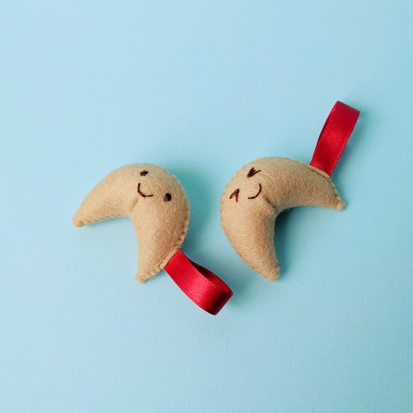 Two happy, felt fortune cookies