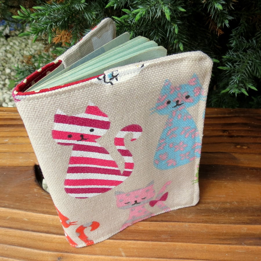 Cats.  A passport sleeve with a whimsical cats design.