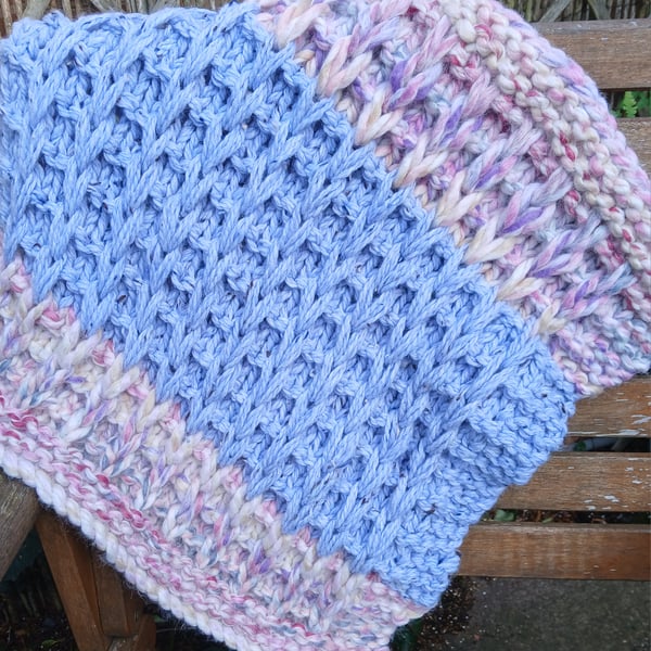 Hand-knitted baby blanket for a cot, basket or pram. Price includes P and P. 