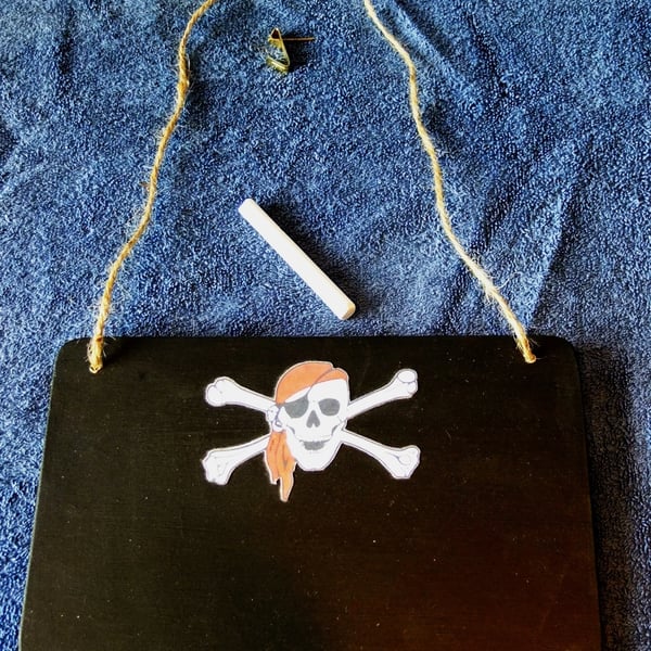 Chalkboard or blackboard with pirate skull & crossbones image for messages notes