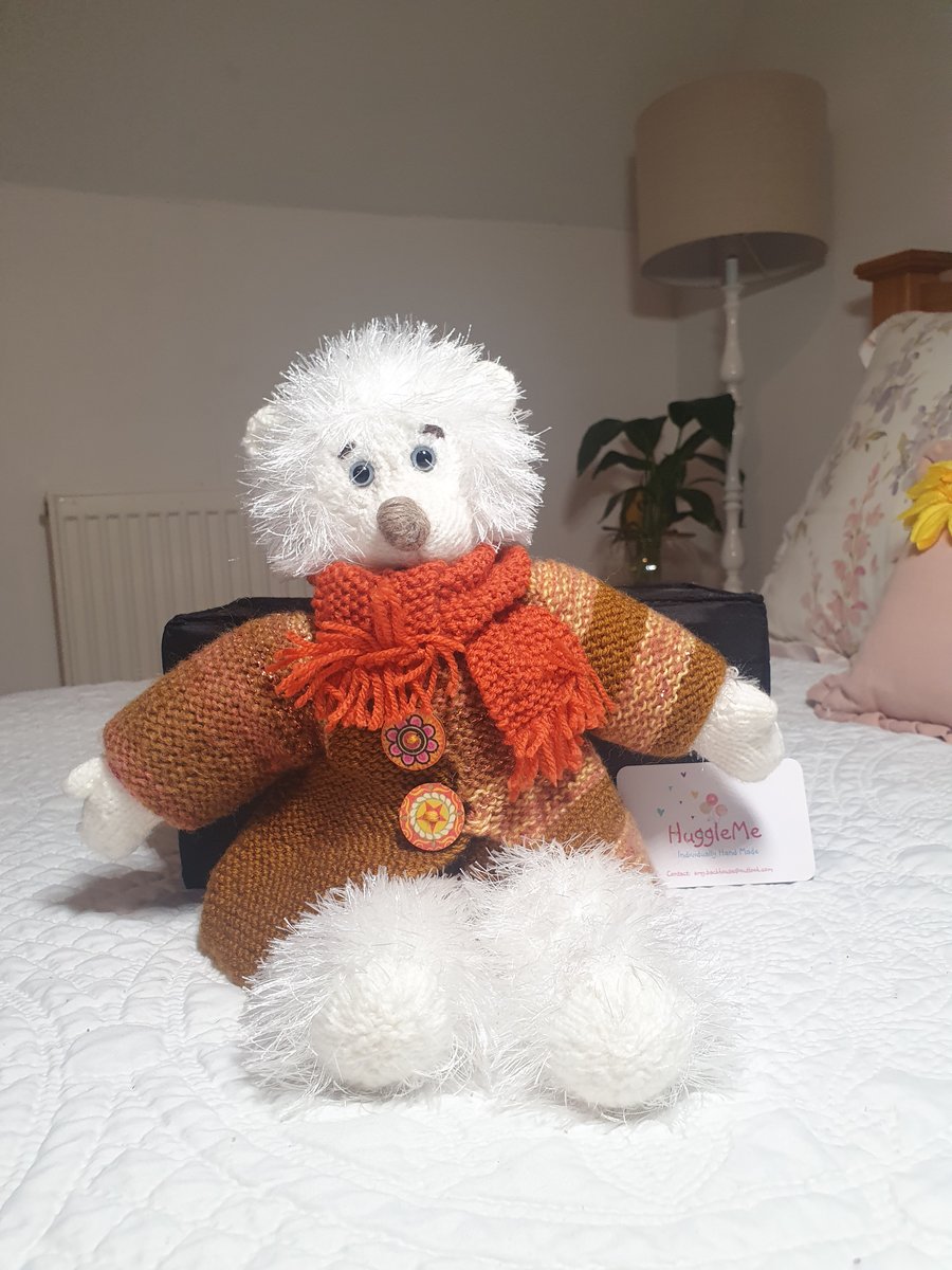 Handmade teddy bear with knitted removable clothes