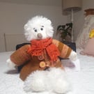 Handmade teddy bear with knitted removable clothes