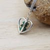 3D Heart Raw Emerald pendant necklace. May birthstone