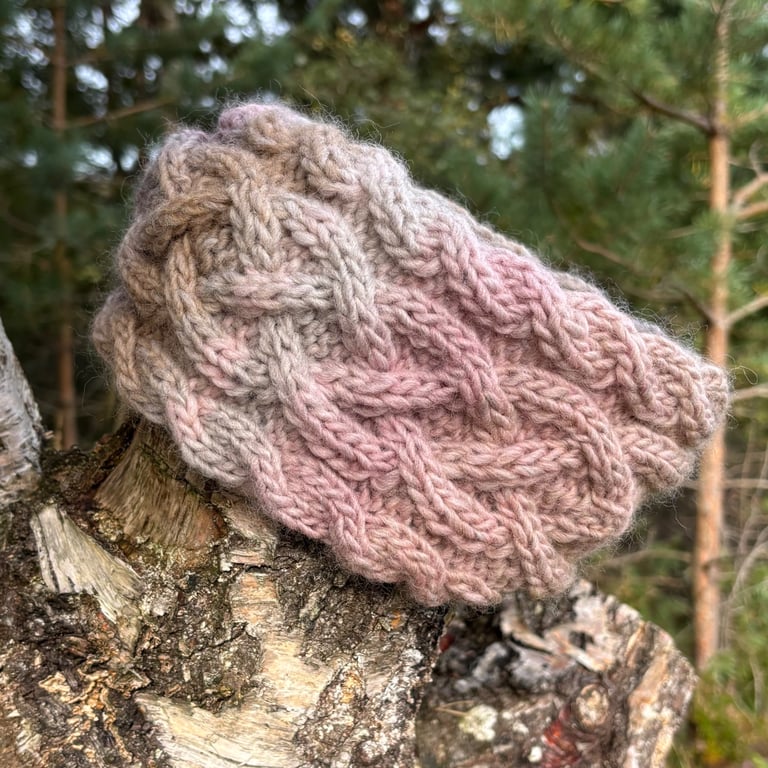 Hand knitted, lined, headband featuring  Celtic knot pattern 