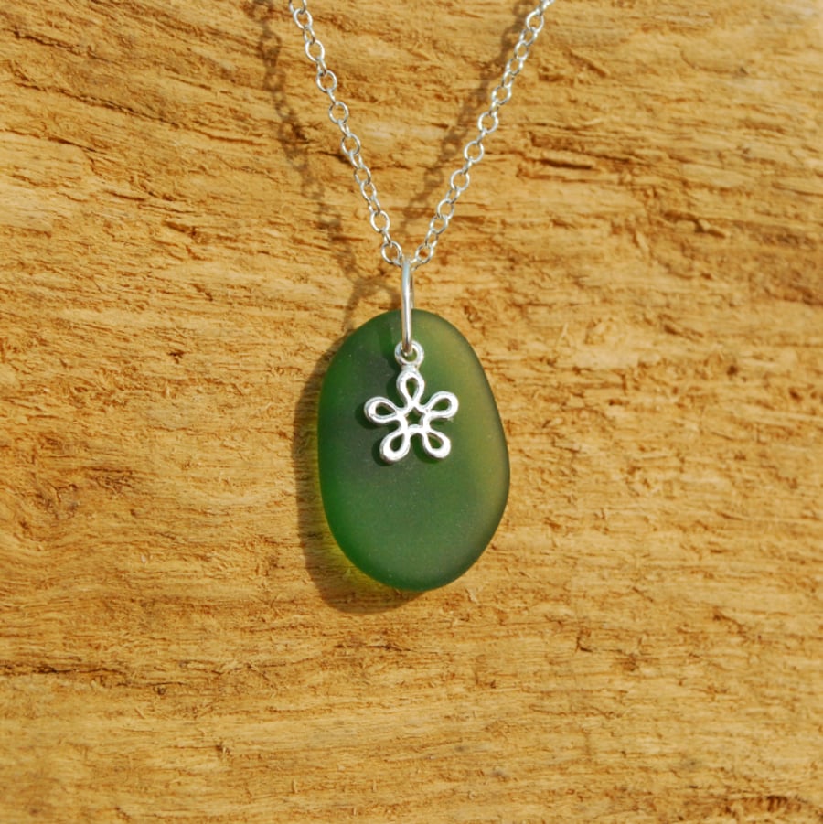Beach glass pendant with tiny flower charm