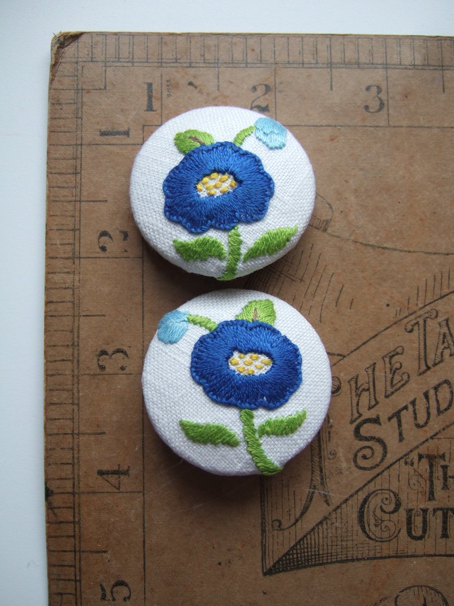 A pair of jumbo extra large buttons, covered with vintage hand sewn embroidery.