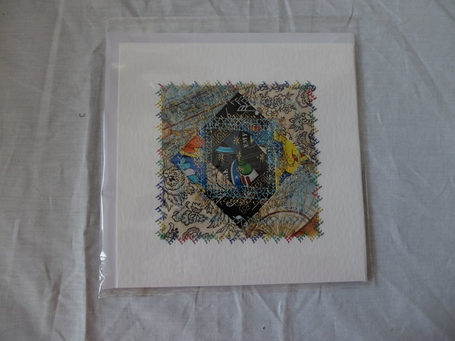 Snail trail quilt block greetings card, blues with gold coloured metallic thread