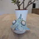 Ceramic shark with googly eyes