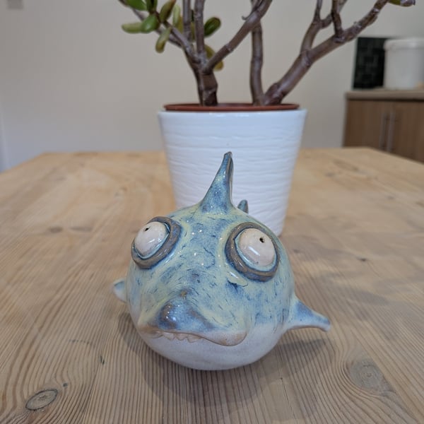 Ceramic shark with googly eyes
